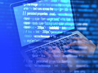 It guy coding on a laptop screen